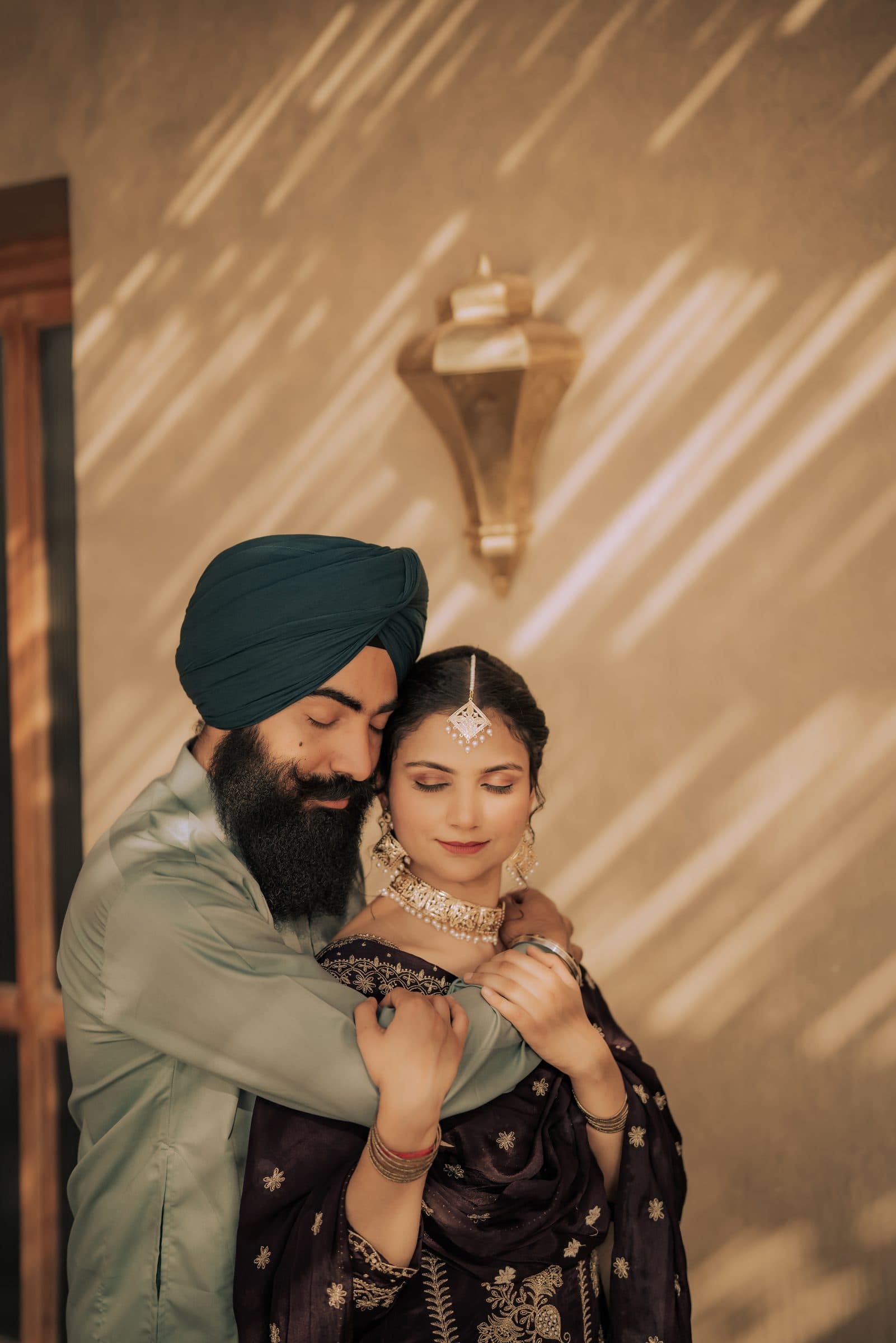 A warmly lit couple portrait from a wedding celebration